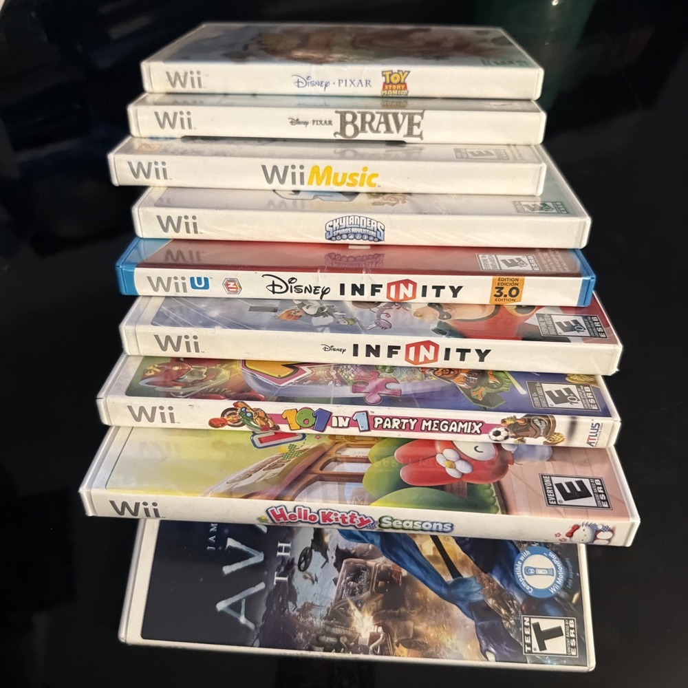 Disney Toy Story Nintendo Wii Lot 8 Games! Brave Avatar Hello Kitty Skylanders